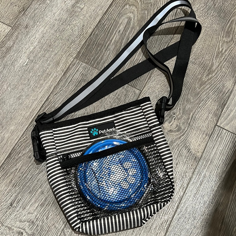 Pet pouch along with a portable bowl.